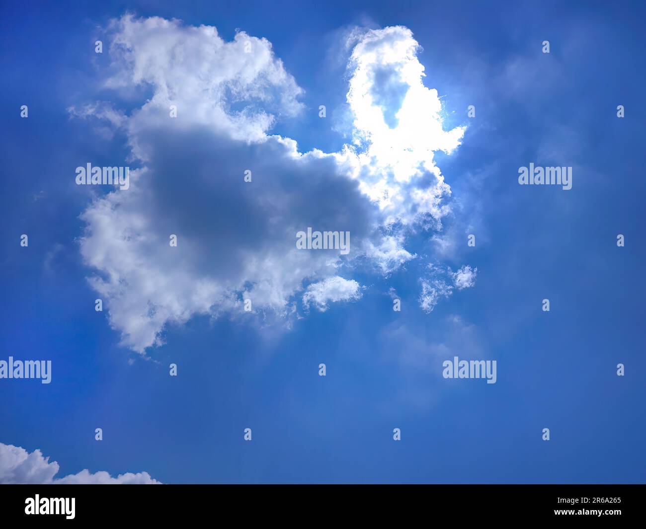 Low angle view of beautiful bright blue sky and white fluffy clouds ...