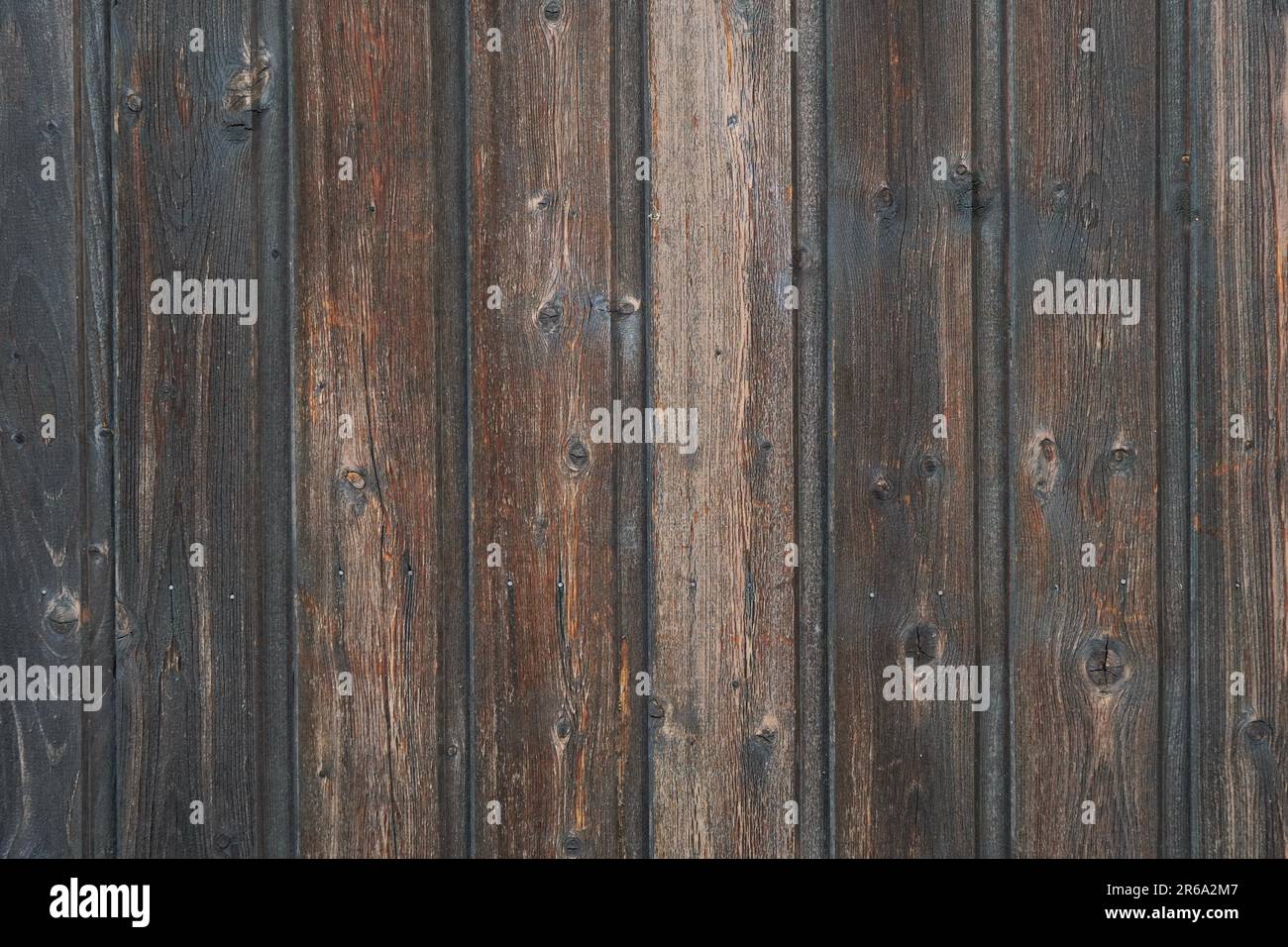 old weathered distressed dark brown wooden boarding wood texture background Stock Photo