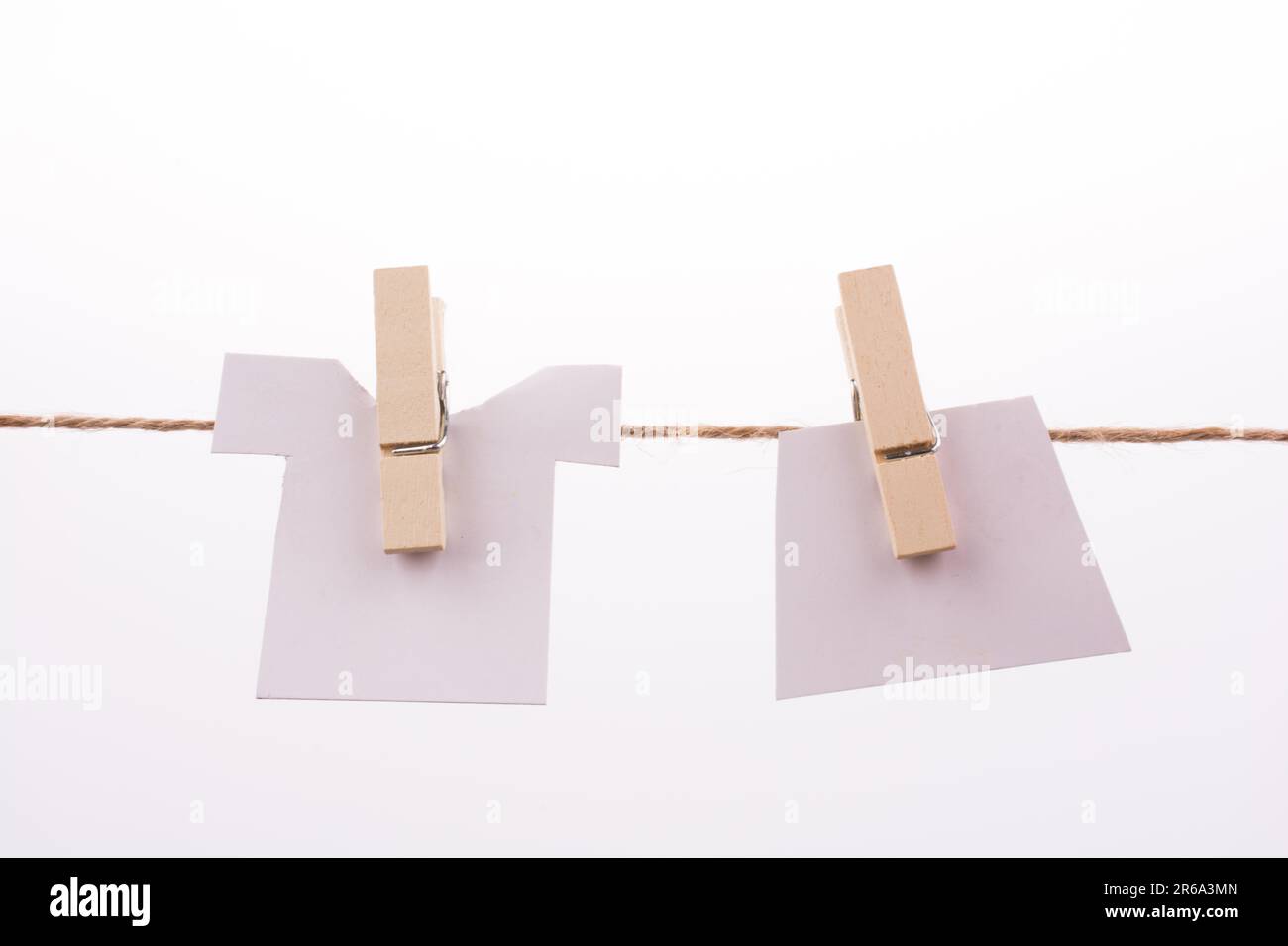 Clothespins holding clothes Stock Photo
