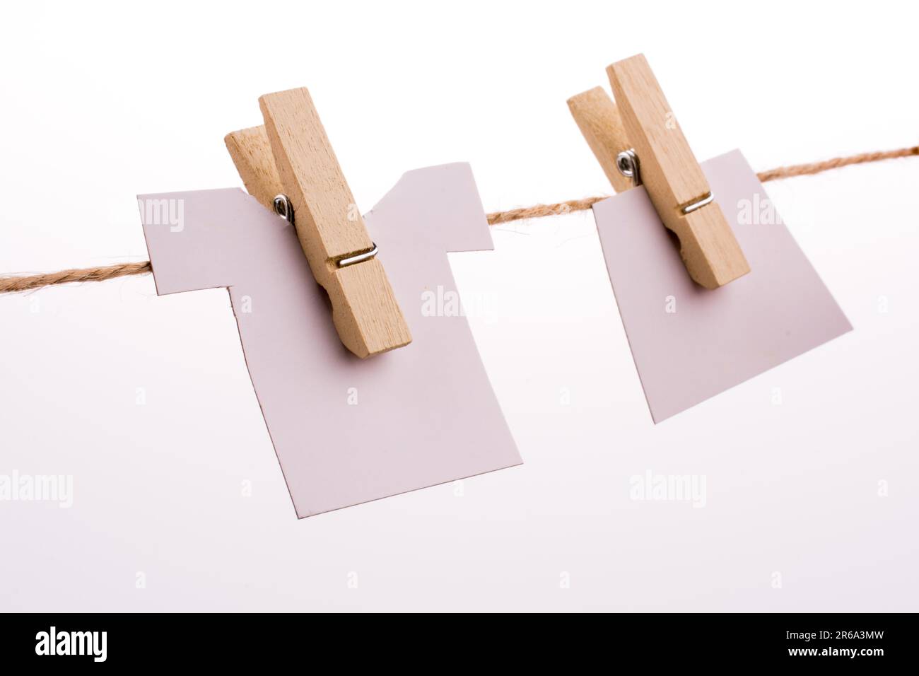 Clothespins holding clothes Stock Photo