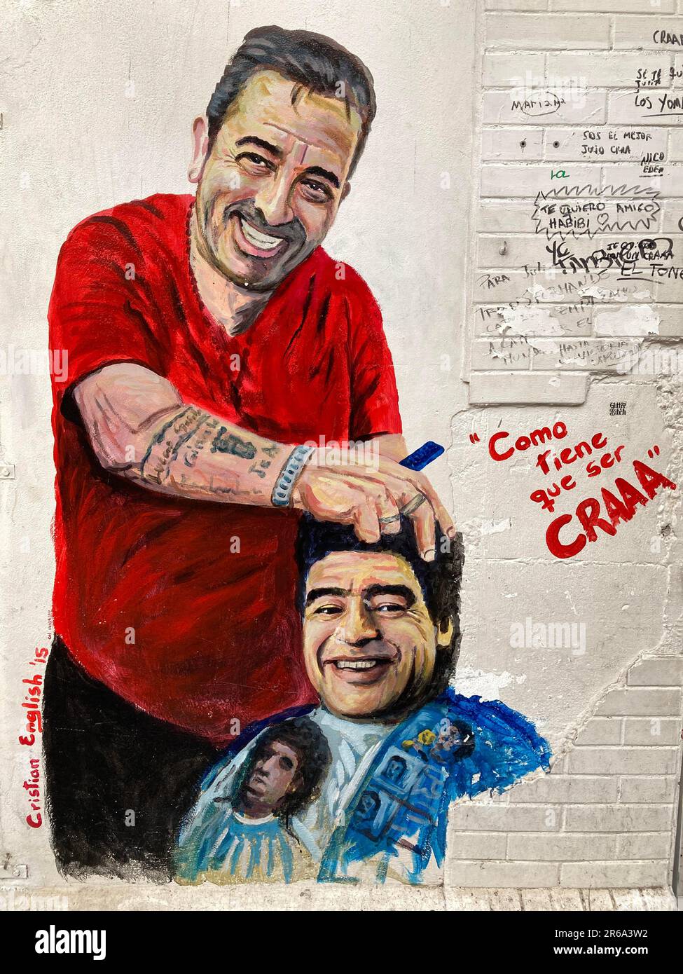 Street art by artist Cristian English shows Diego Maradona getting a haircut, Buenos Aires, Argentina Stock Photo