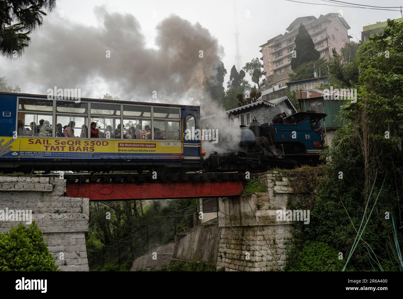 DARJEELING, INDIA, MAY 25 Tourists travel in a steam loco engined toy
