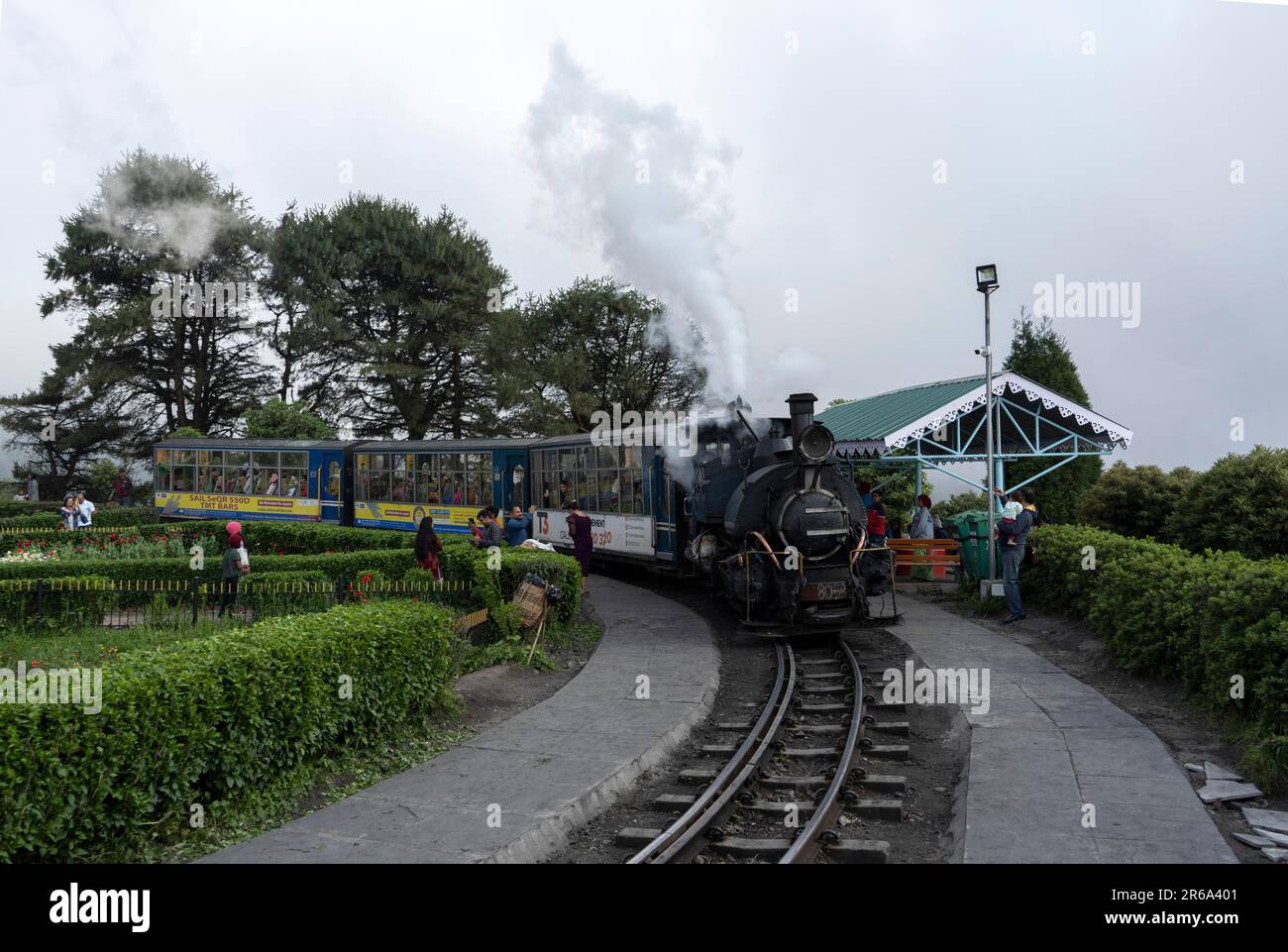 DARJEELING, INDIA, MAY 25 Tourists travel in a steam loco engined toy
