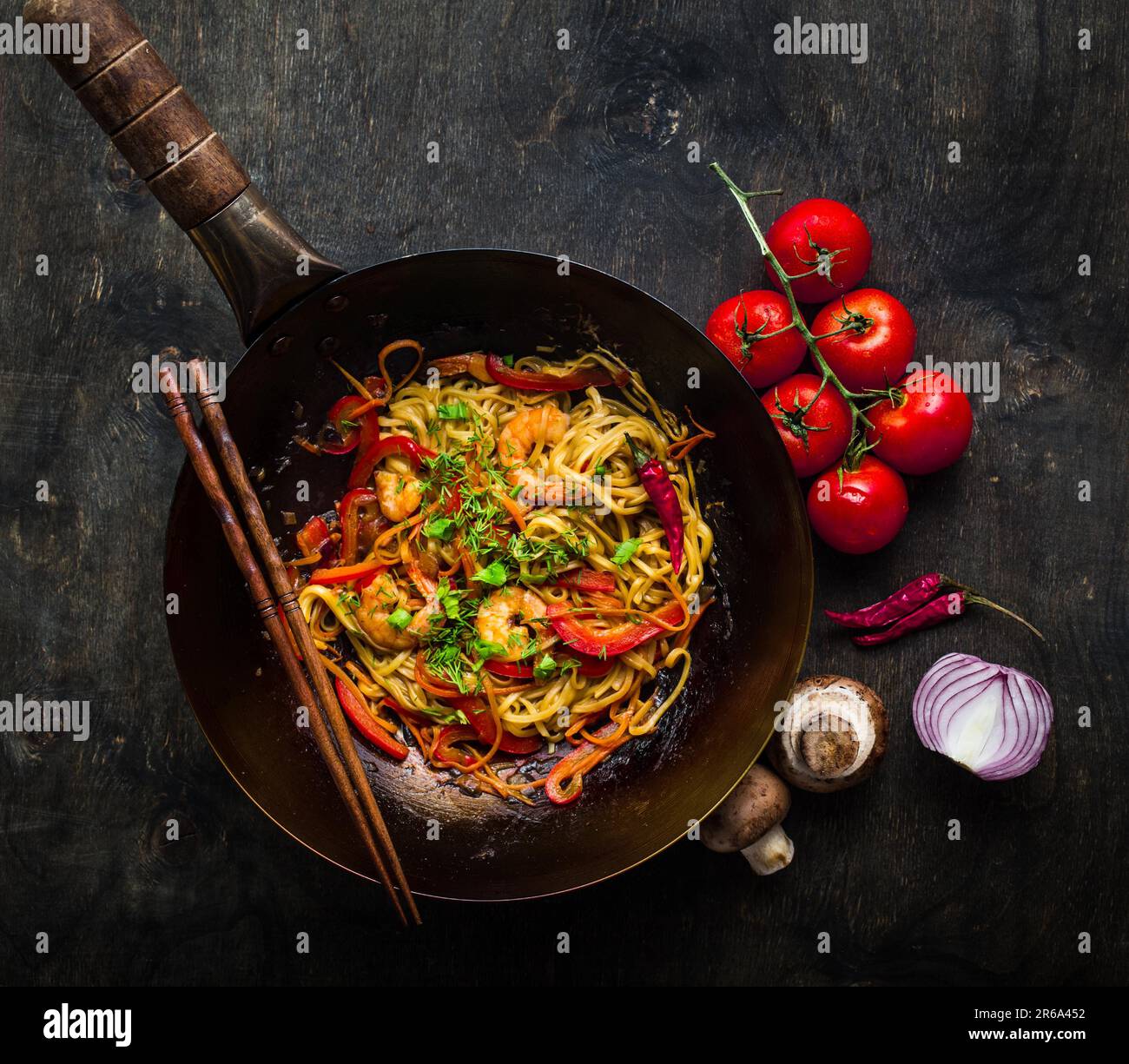 Stir fry noodles in traditional Chinese wok, chopsticks. Asian noodles with  vegetables, shrimps. Wok noodles, Chinese dinner/lunch. Black dark Stock  Photo - Alamy