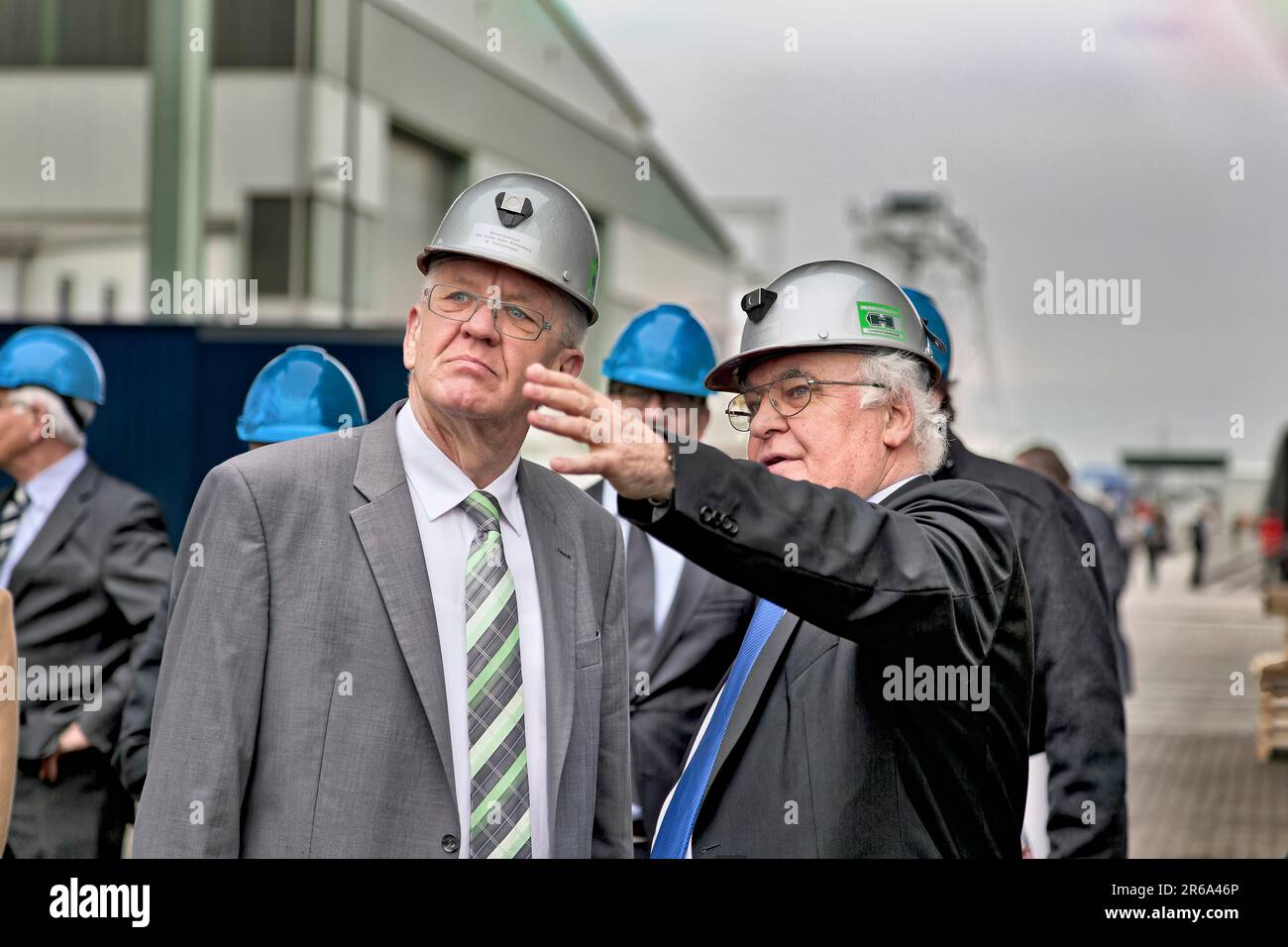 Minister President Winfried Kretschmann with Martin Herrenknecht - both wearing safety helmets - during a visit to Herrenknecht AG. Tunnel, tunnel Stock Photo