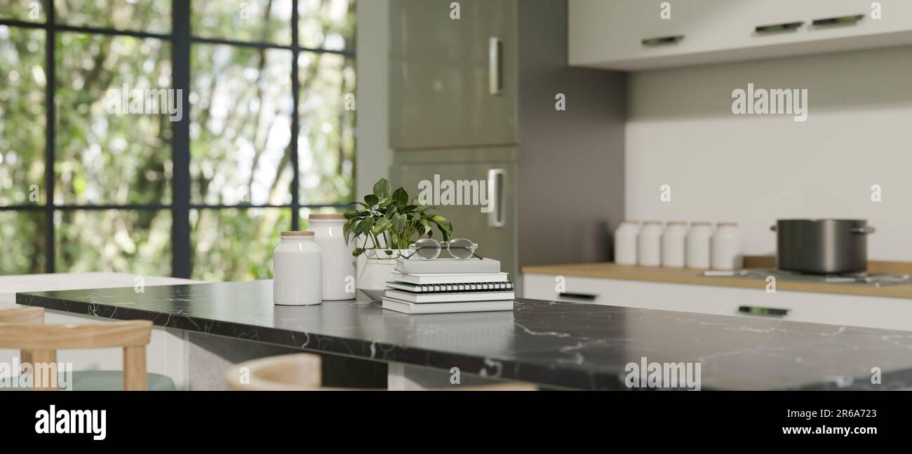 Copy space on a black marble kitchen countertop in a modern white ...