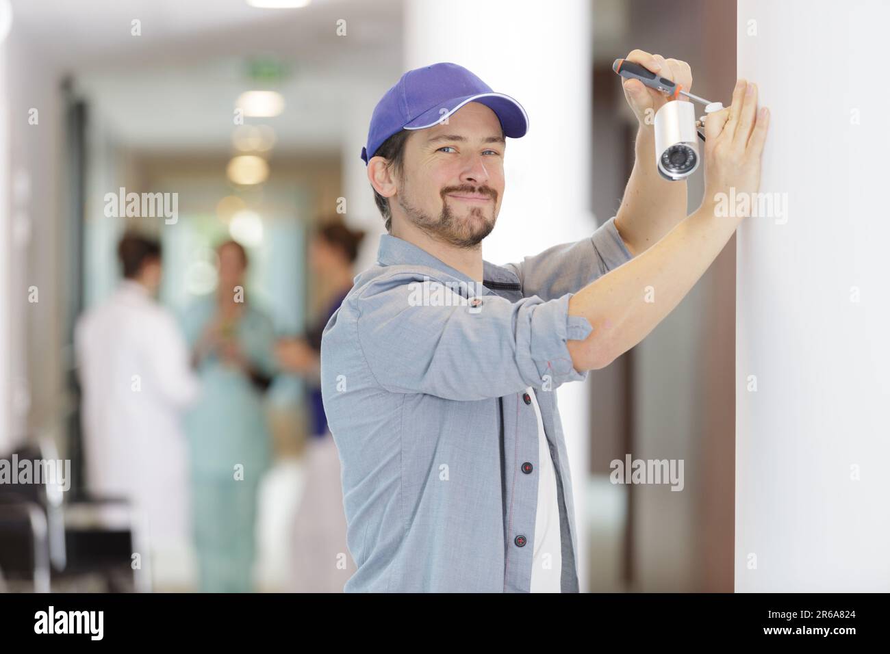 professional cctv technician working in hospital Stock Photo