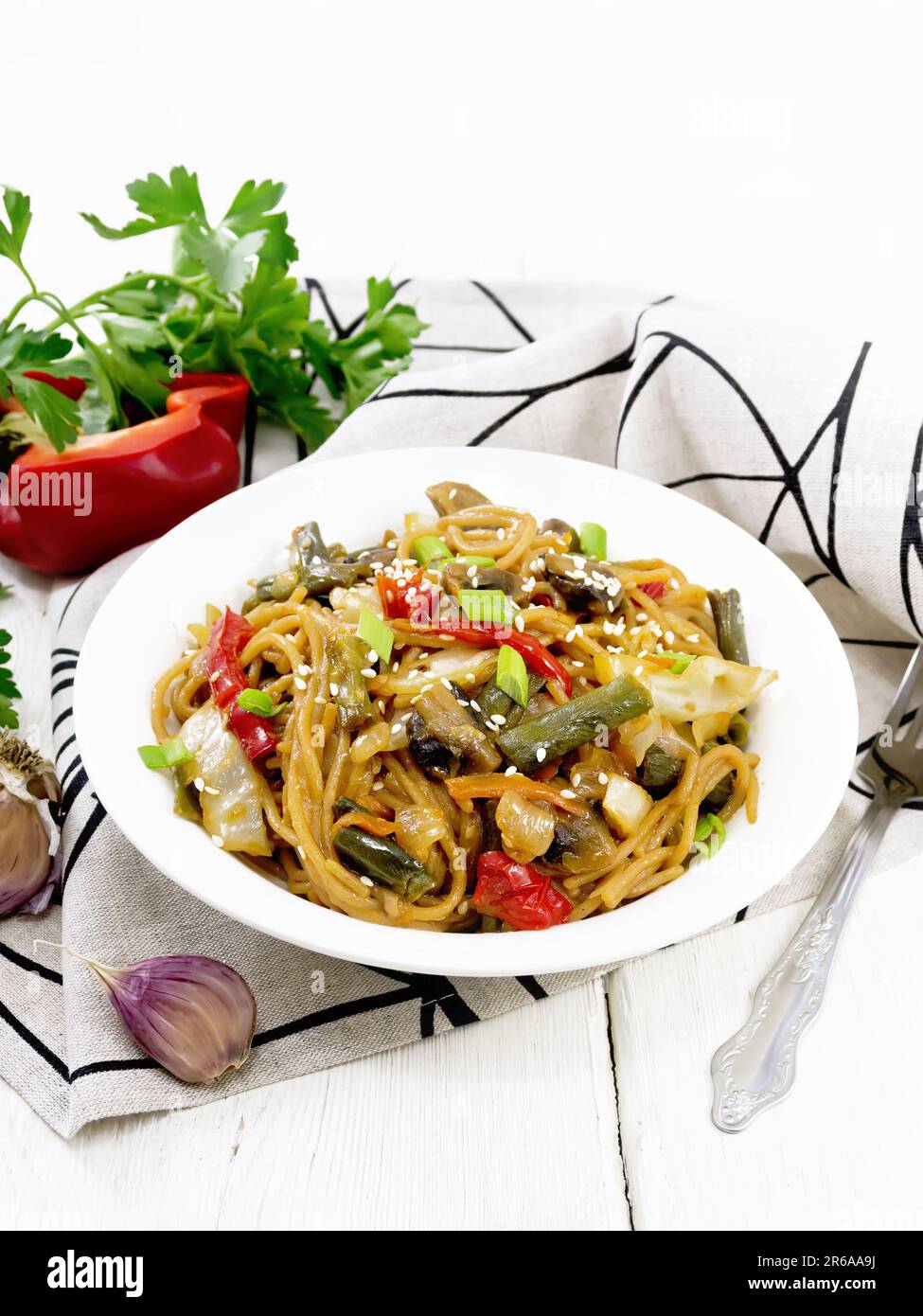 Spaghetti buckwheat soba with cabbage, champignons, sweet peppers