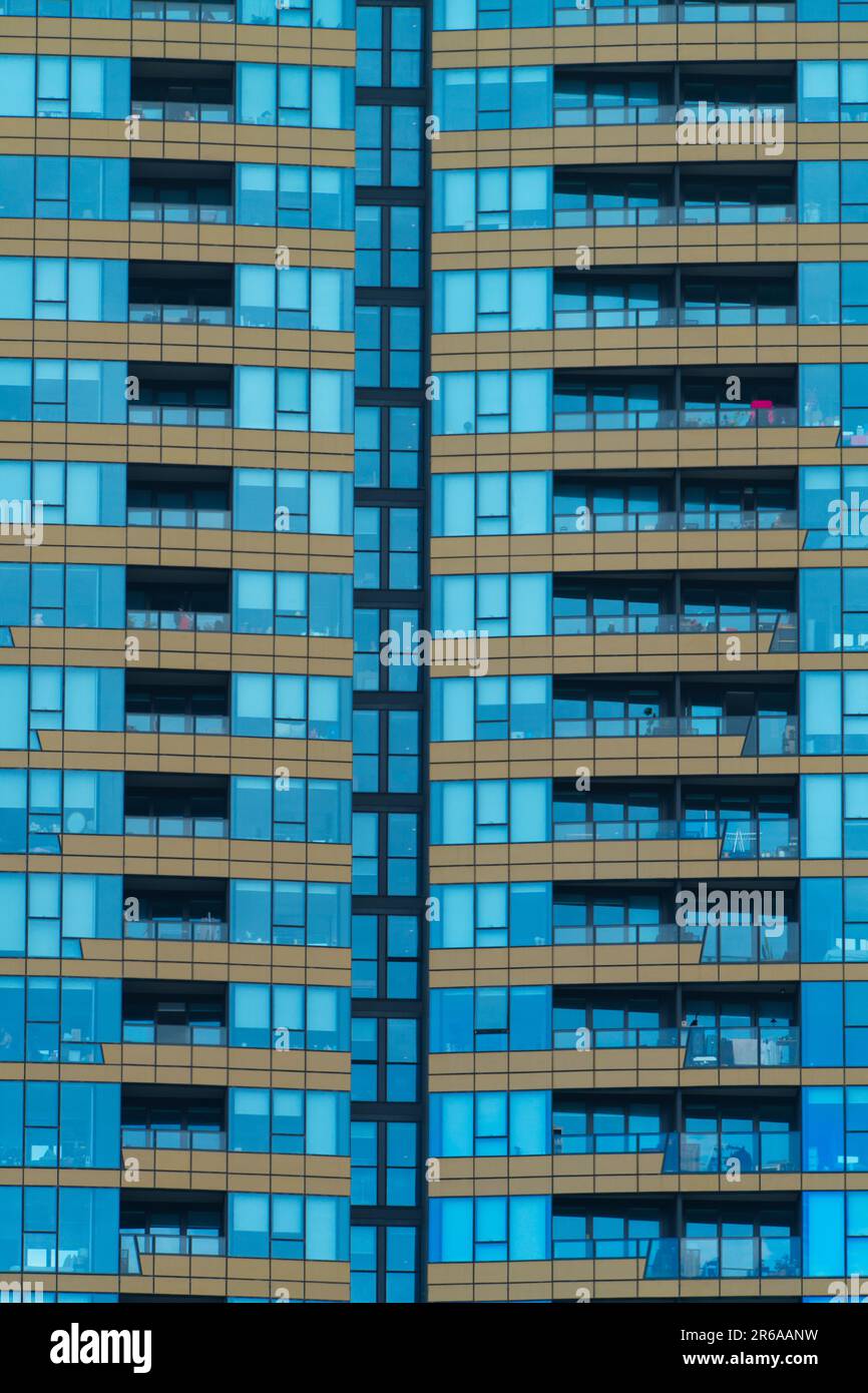 Apartment building exterior view showing blue tinted glass windows and balconies, Melbourne, Australia. Stock Photo