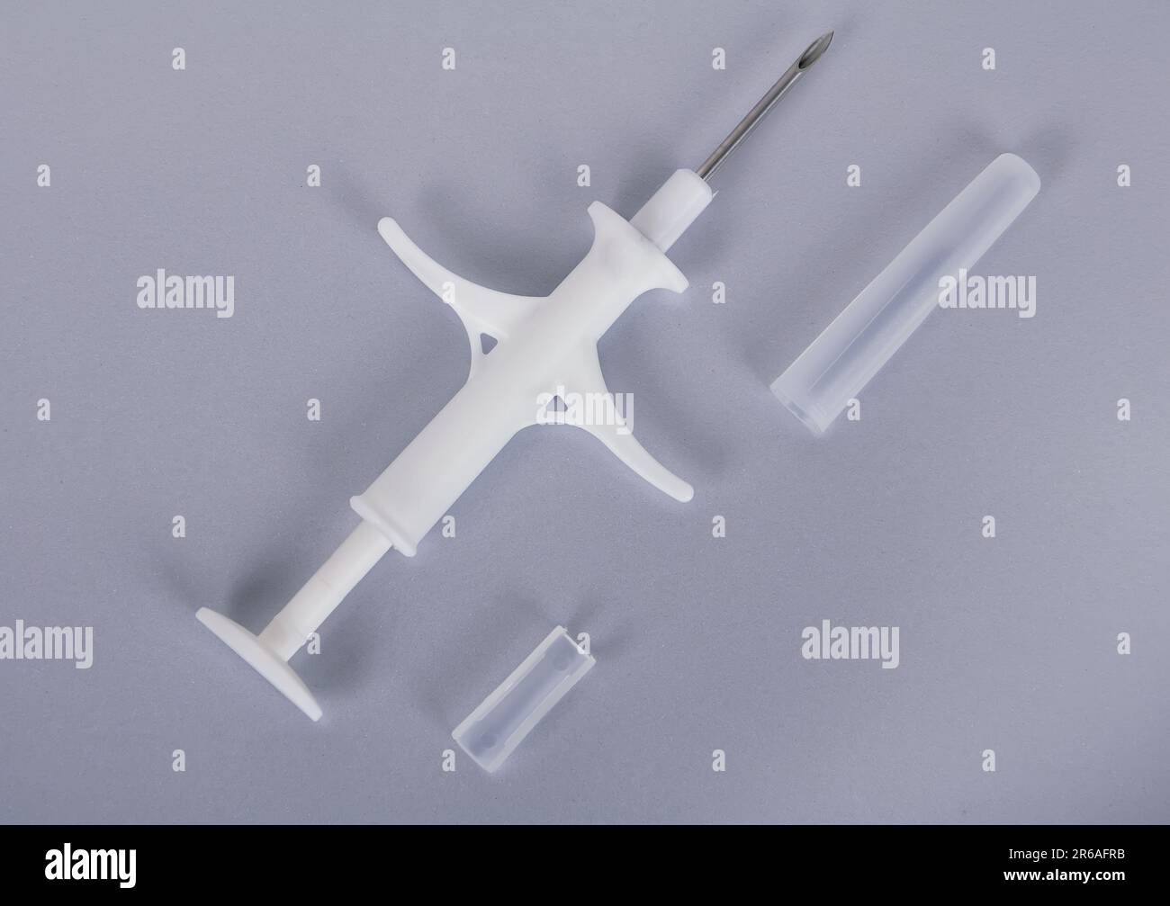 Syringe for introduction of chip Stock Photo