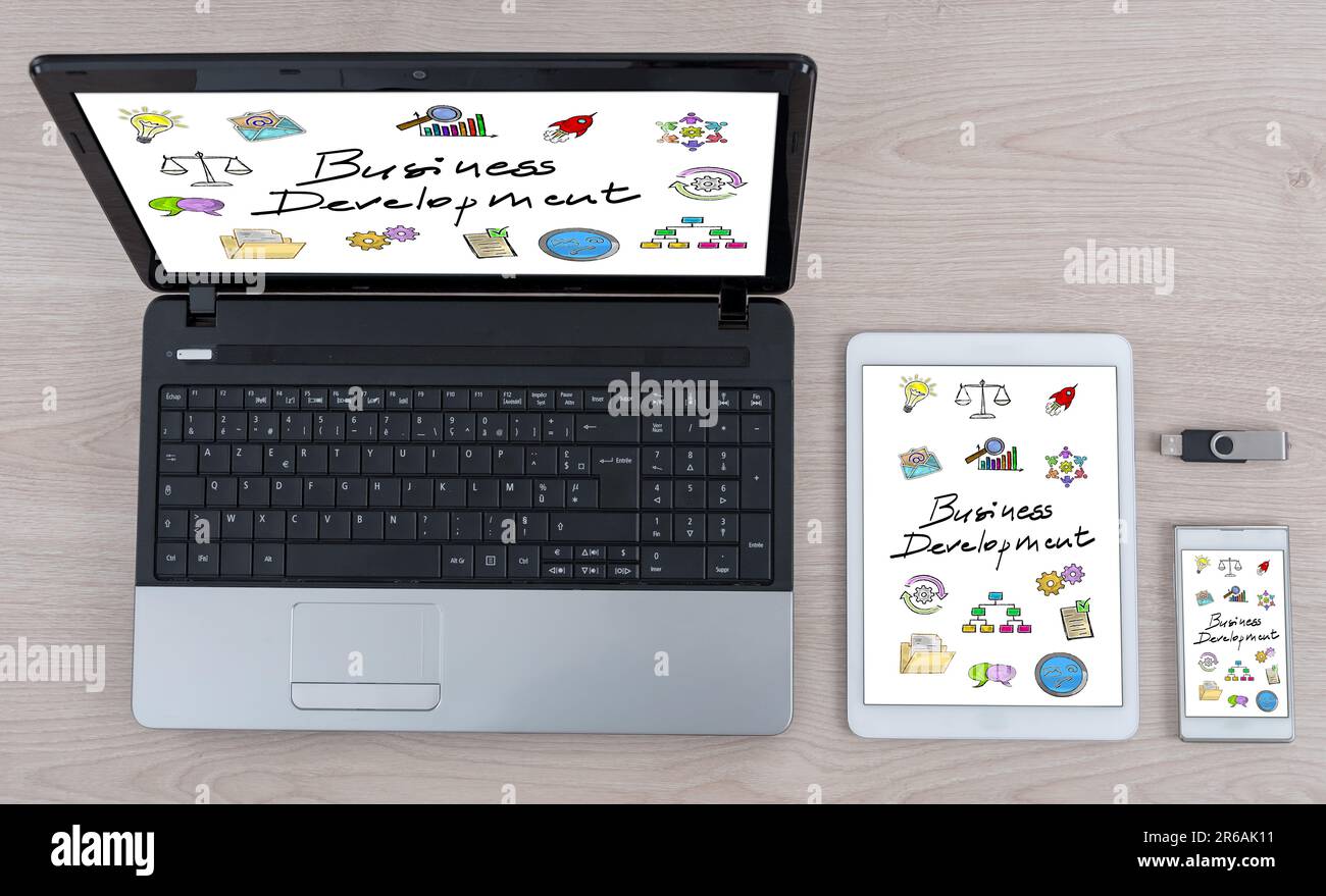 Business development concept shown on different information technology devices Stock Photo