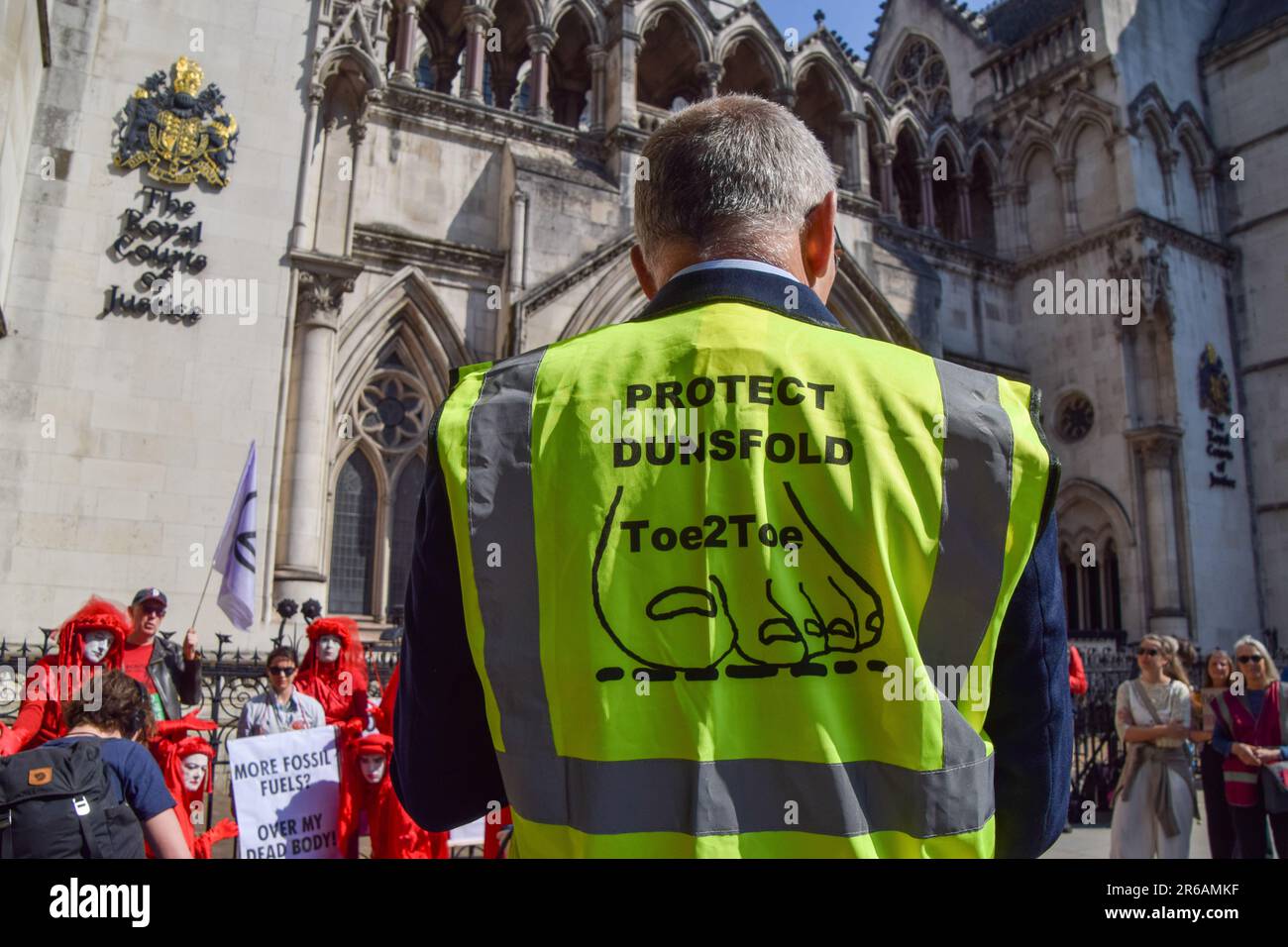London, UK. 8th June 2023. A member of Protect Dunsfold gives a speech outside the Royal Courts of Justice ahead of the judicial review of the planning permission for UK Oil & Gas to explore for fossil fuels near the village of Dunsfold. Credit: Vuk Valcic/Alamy Live News Stock Photo