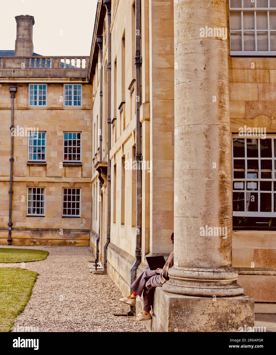 Studying outside alone at a college in Cambridge Stock Photo
