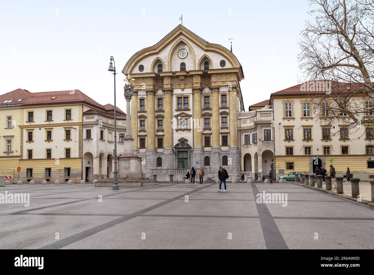 LJUBLJANA, SLOVENIA - MARTH 7, 2023: This is the Ursuline Church of the Holy Trinity and the plague column in Congress Square. Stock Photo