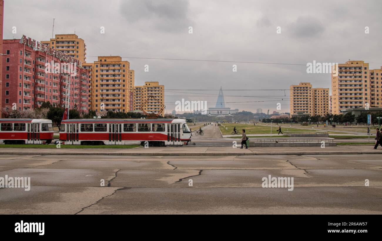 Pyongyang, North Korea (DPRK - Democratic People's Republic of Korea). April 2018. Kim Il-Sung and Kim Jong-Il statues and Ryugyong hotel. Stock Photo