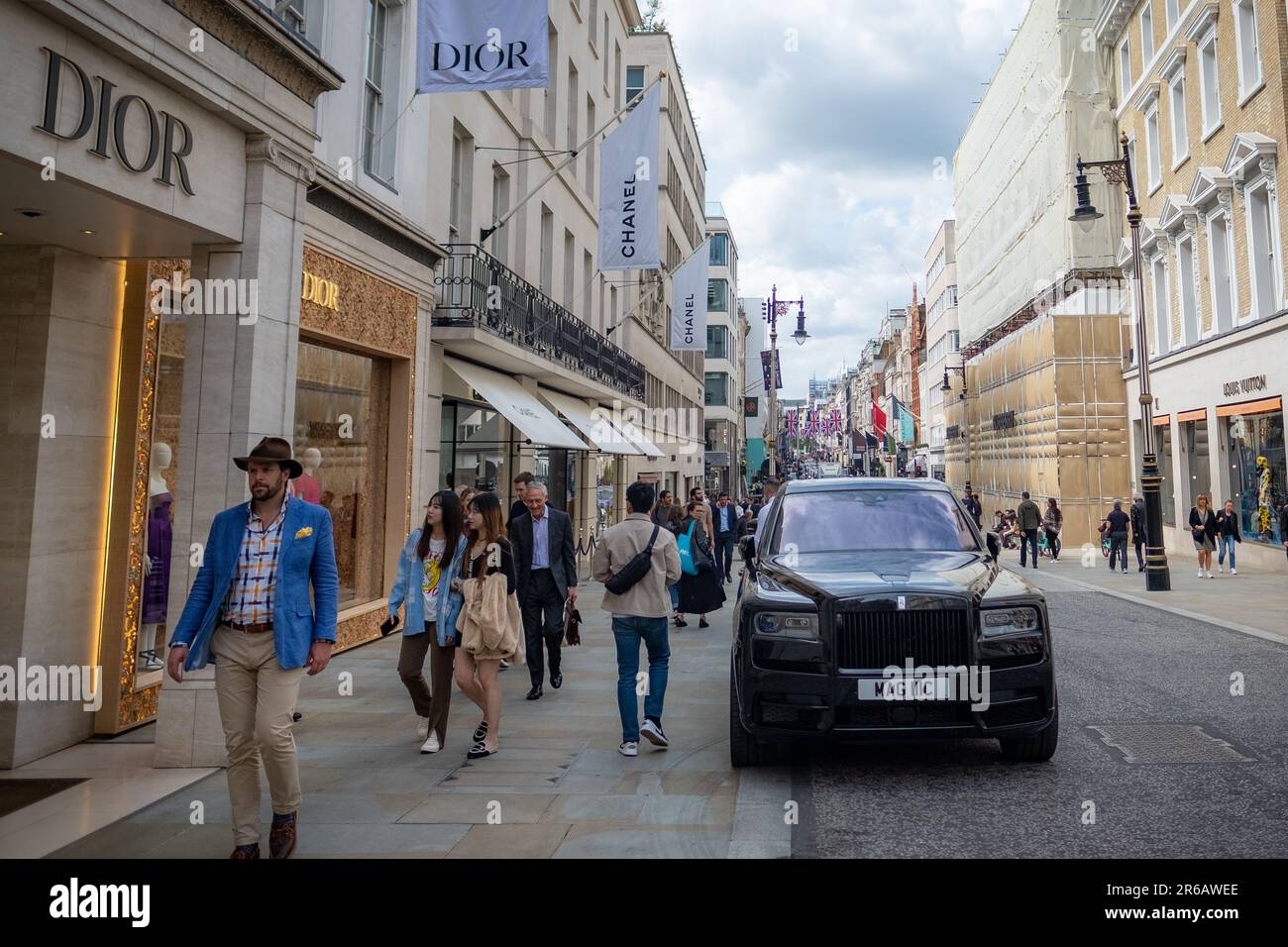 London- May 2023: Shoppers on Bond Street, a landmark high street and famous retail destination in the West End Stock Photo