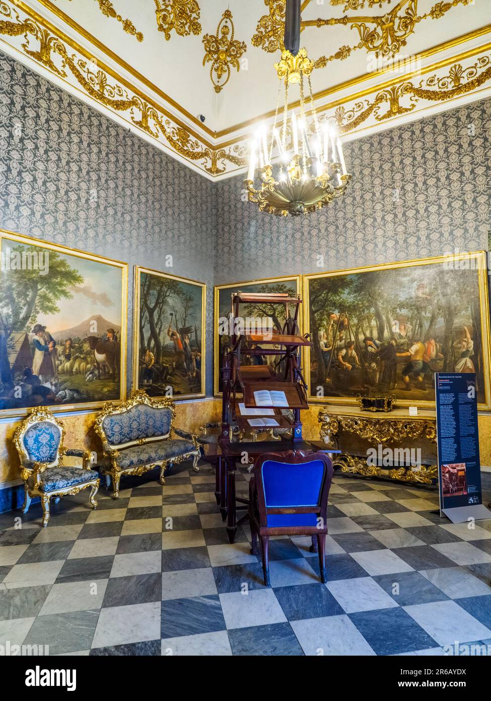 Neo-baroque backroom with a rotating reading desk - Royal Palace of Naples that In 1734 became the royal residence of the Bourbons - Naples, Italy Stock Photo