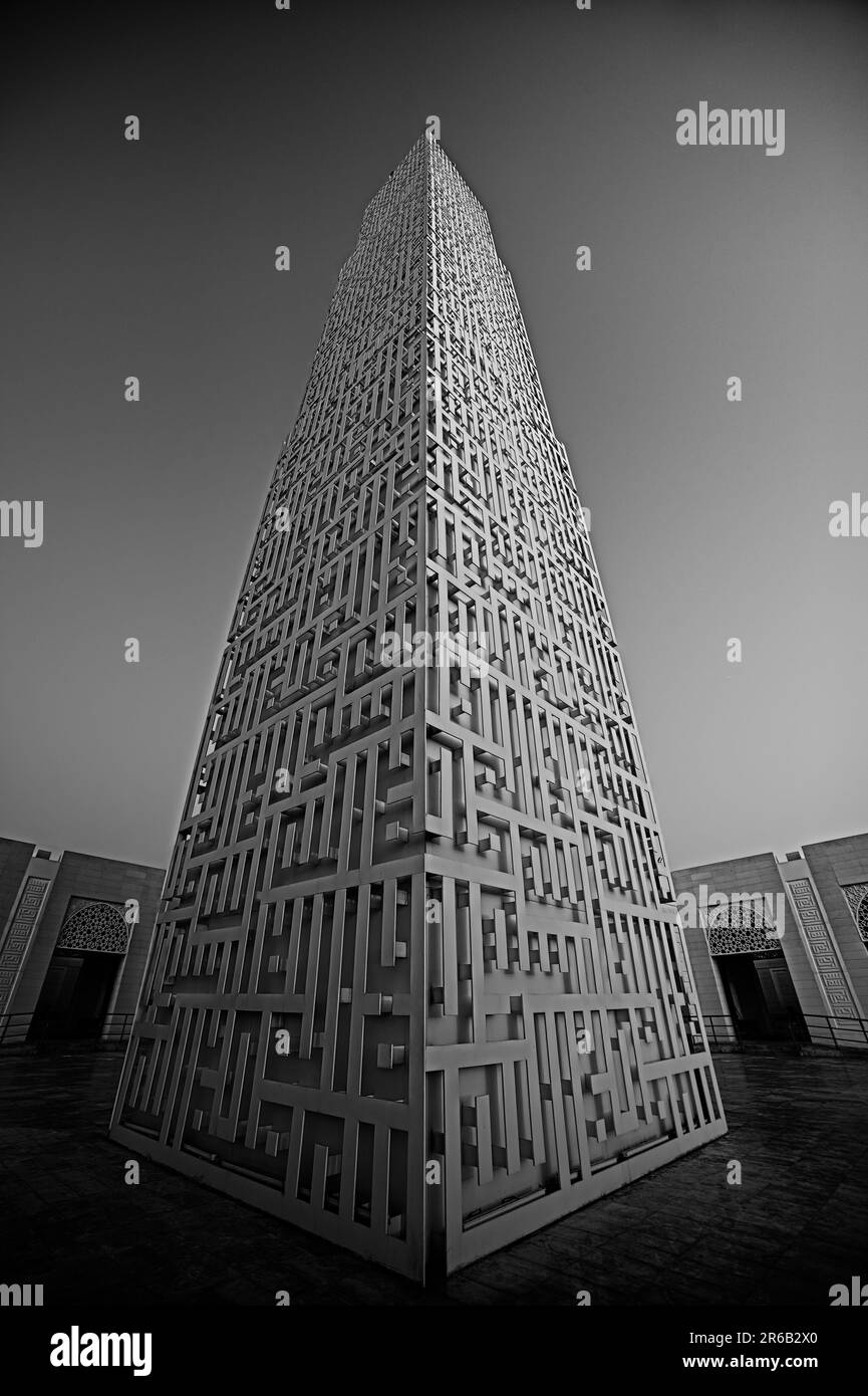 A vertical grayscale shot of the Amna Bint Ahmed Al Ghurair Mosque in Ajman, UAE Stock Photo