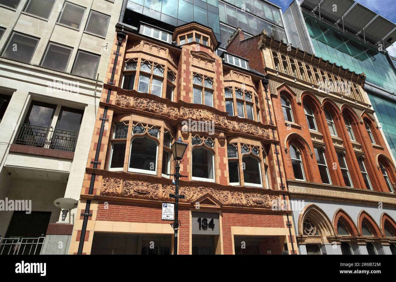 Old building facades surrounded by modern architecture on Edmund Street in the centre of Birmingham. Stock Photo