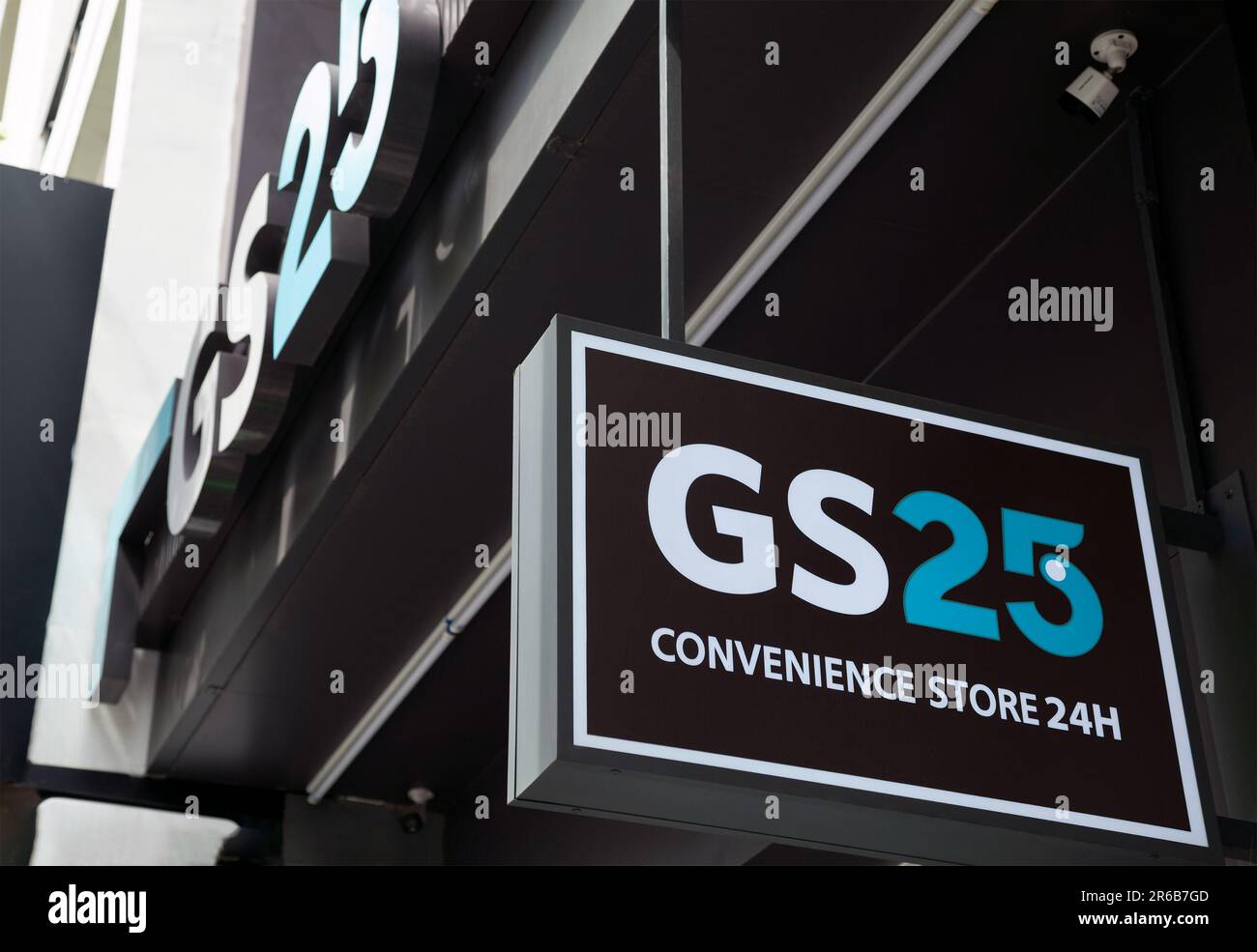 Ho Chi Minh City, Vietnam - June 4, 2023: Blue and black information sign with GS25 logo on a convenience store. Lightbox advertisement outside a groc Stock Photo