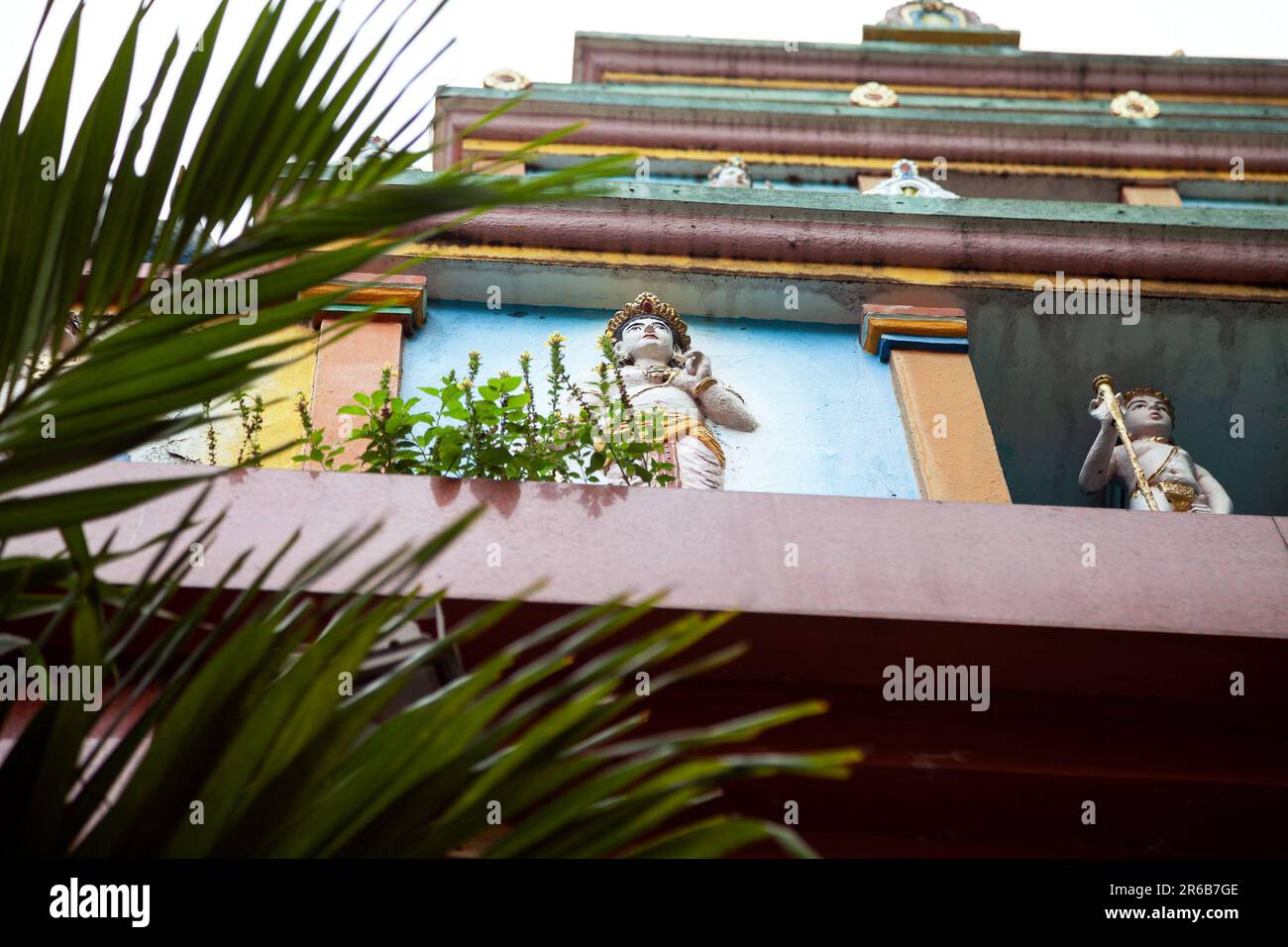 Hindu Sri Thendayyutthapani temple exterior close-up with painted god sculptures. Exterior of an Indian shrine in Ho Chi Minh City decorated with trad - Stock Image