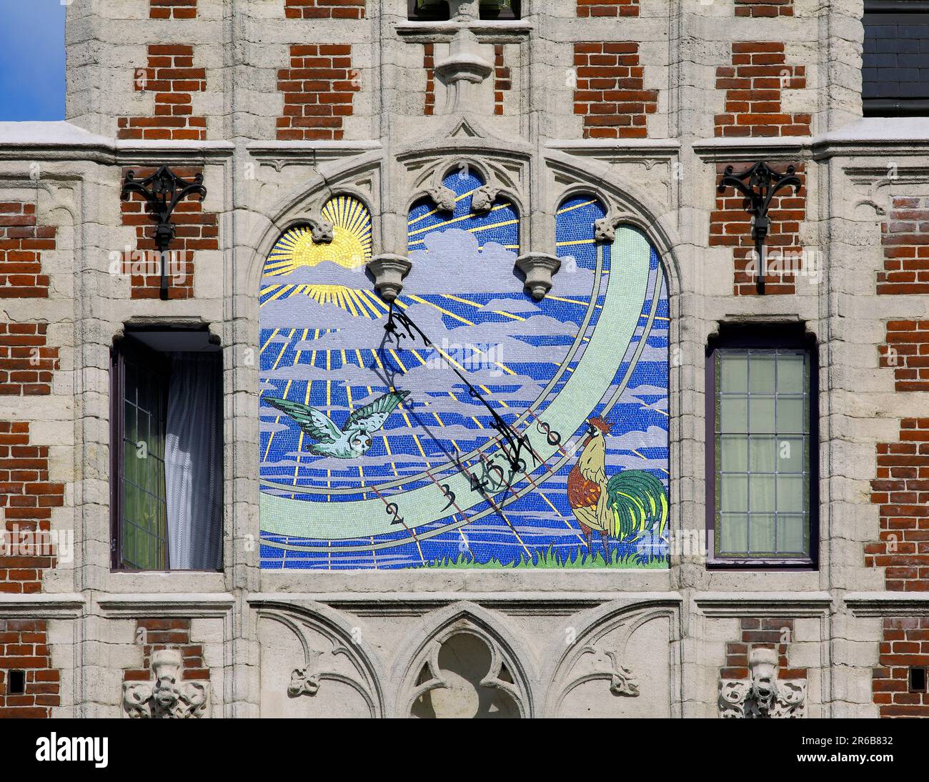 A magnificent mosaic sundial, high up on the side of the former Delacre Pharmacy, in the heart of Brussels. Stock Photo
