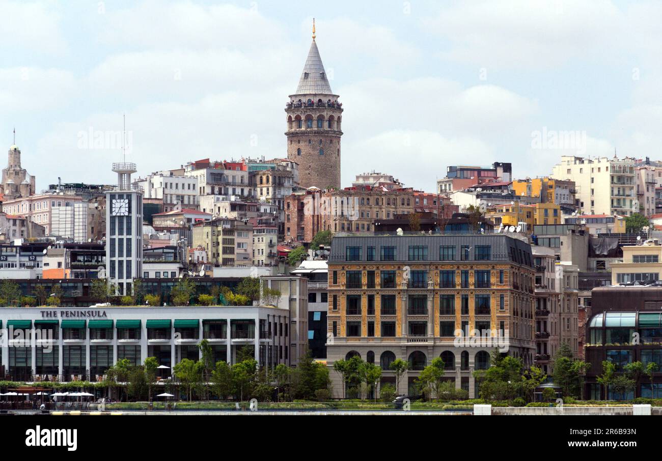 The ancient Galata Tower rises above crowded buildings in Istanbul ...