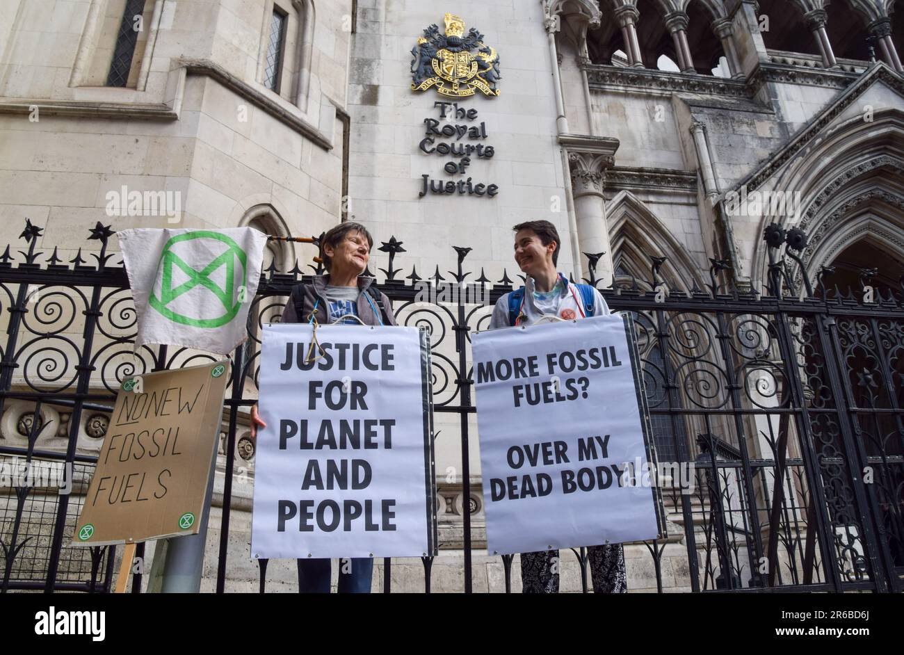 London, UK. 08th June, 2023. Protesters hold anti-fossil fuels placards during the demonstration. Climate protesters gathered outside the Royal Courts of Justice during the judicial review of the planning permission for UK Oil And Gas to explore for fossil fuels near the village of Dunsfold. Credit: SOPA Images Limited/Alamy Live News Stock Photo