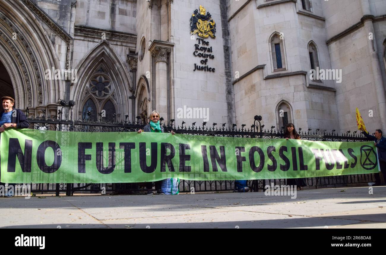 London, UK. 08th June, 2023. Protesters hold an anti-fossil fuels banner during the demonstration. Climate protesters gathered outside the Royal Courts of Justice during the judicial review of the planning permission for UK Oil And Gas to explore for fossil fuels near the village of Dunsfold. Credit: SOPA Images Limited/Alamy Live News Stock Photo