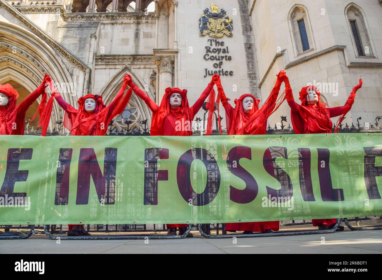 London, UK. 08th June, 2023. Extinction Rebellion protesters wearing red costumes, known as the Red Rebel Brigade, perform during the demonstration. Climate protesters gathered outside the Royal Courts of Justice during the judicial review of the planning permission for UK Oil And Gas to explore for fossil fuels near the village of Dunsfold. (Photo by Vuk Valcic/SOPA Images/Sipa USA) Credit: Sipa USA/Alamy Live News Stock Photo