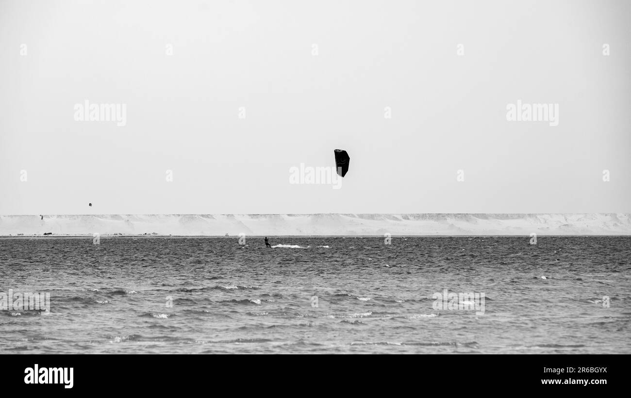 People Practicing Kitesurf on the Beach of Dakhla in the south of Morocco Stock Photo