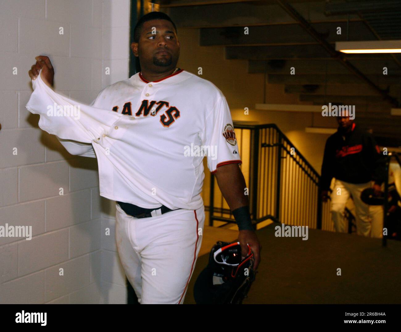 Pablo Sandoval removes his jersey as he enters the clubhouse after the San  Francisco Giants' 4-2 loss to the San Diego Padres at AT&T Park on  Saturday. (Paul Chinn/San Francisco Chronicle via
