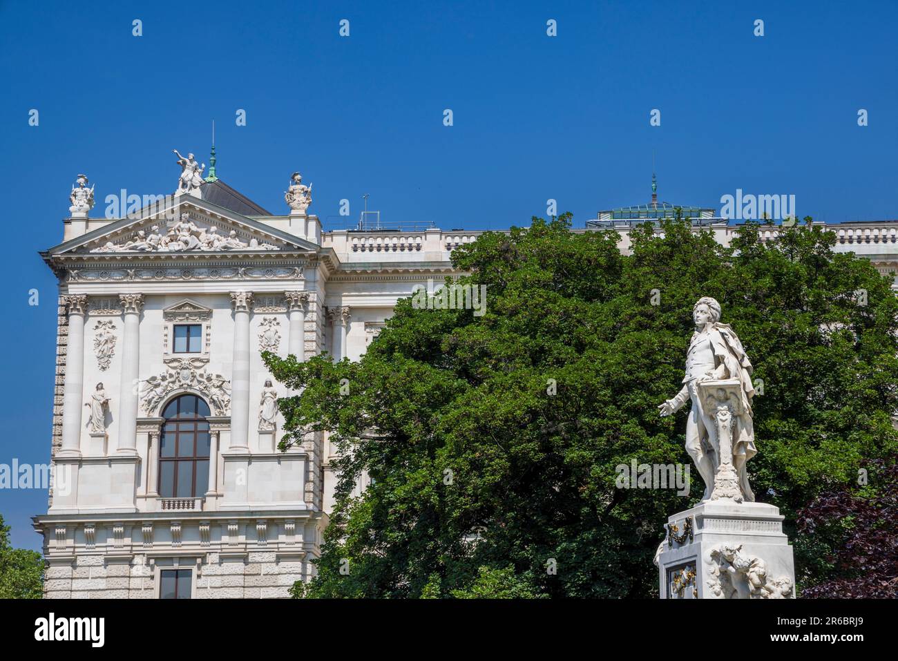 The Mozart Monument in the Burggarten with the Hofburg Palace in the background, Vienna, Austria Stock Photo