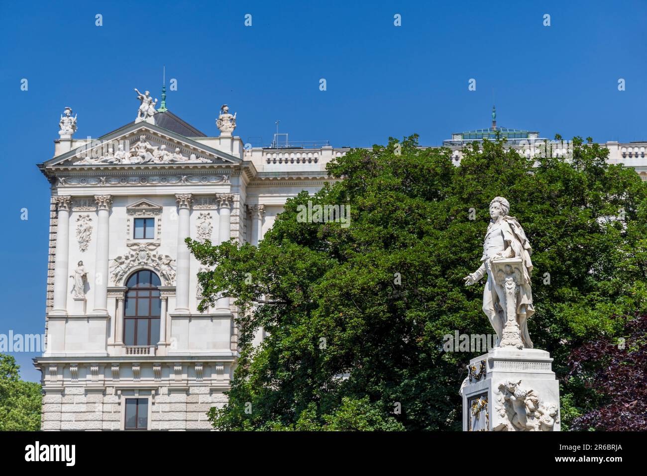The Mozart Monument in the Burggarten with the Hofburg Palace in the background, Vienna, Austria Stock Photo