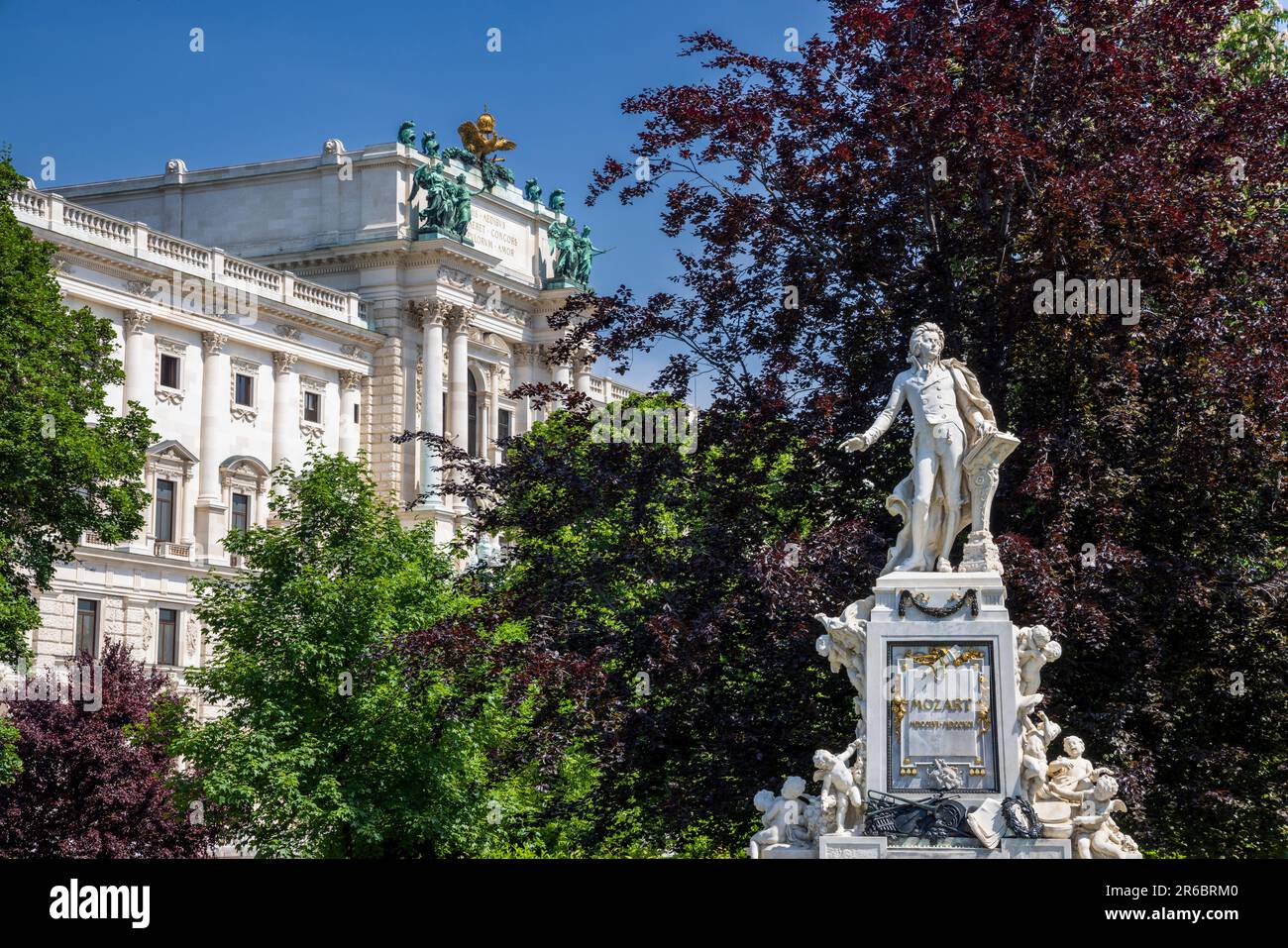 The Mozart Monument in the Burggarten with the Hofburg Palace in the background, Vienna, Austria Stock Photo