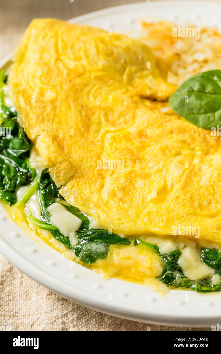 Homemade Spinach Florentine Omelet with Cheese and Potatoes Stock Photo