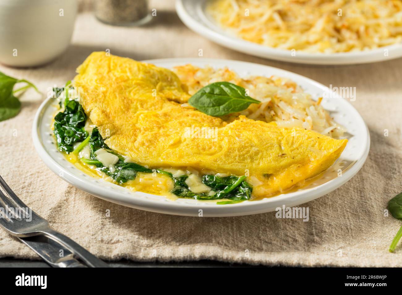 Homemade Spinach Florentine Omelet with Cheese and Potatoes Stock Photo