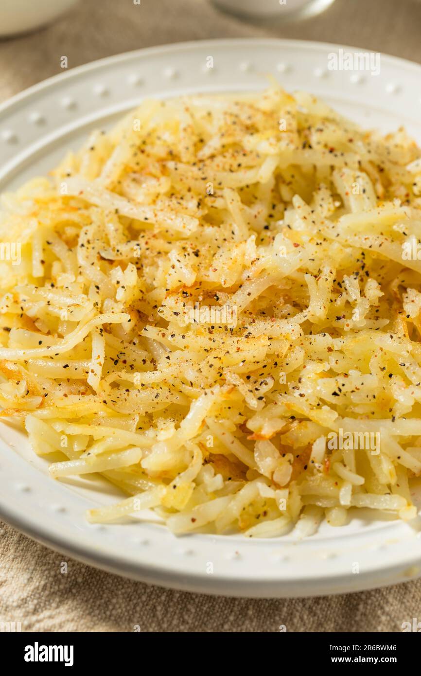 Homemade Breakfast Potato Hash Browns with Salt and Pepper Stock Photo