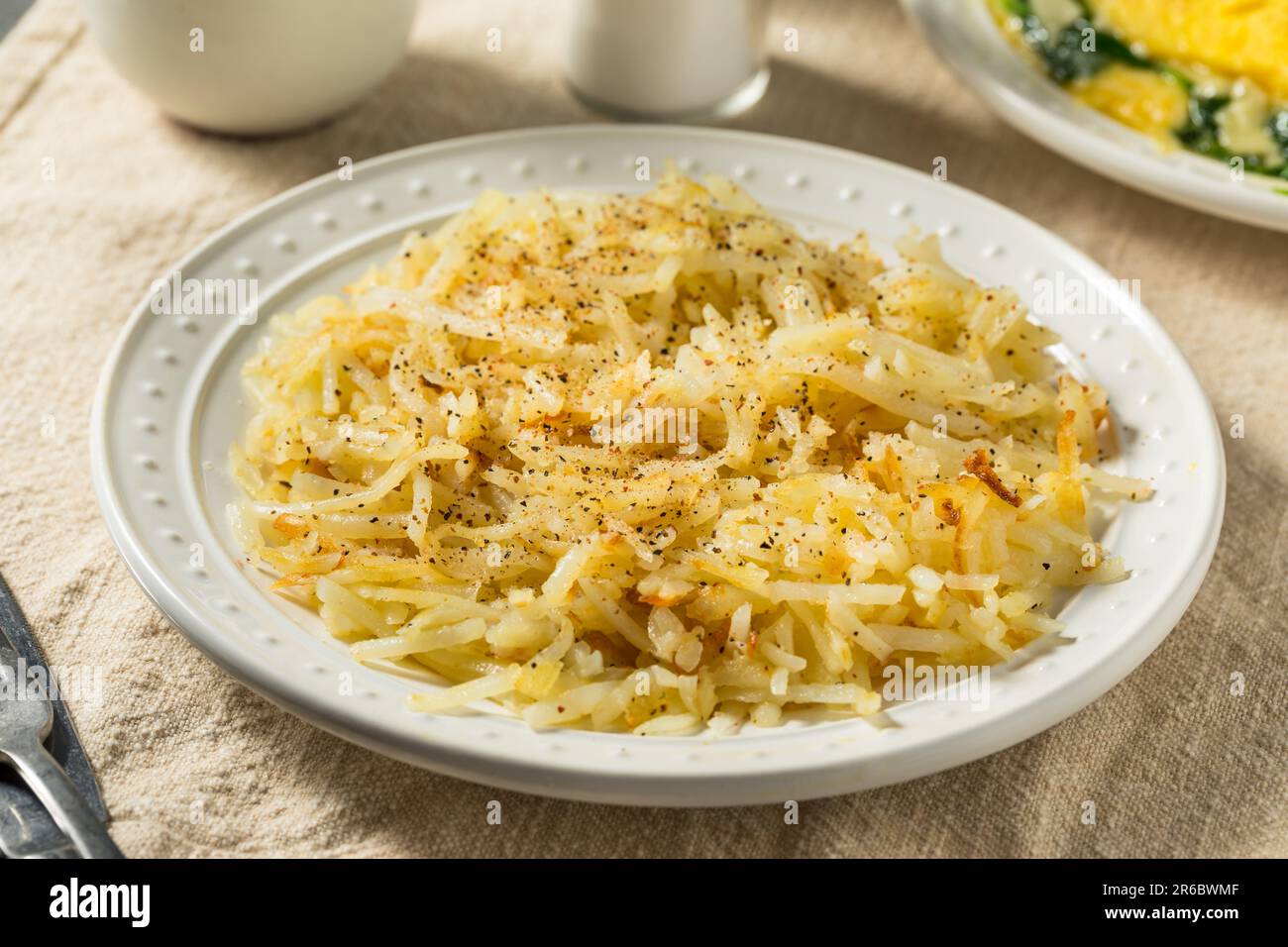 Homemade Breakfast Potato Hash Browns with Salt and Pepper Stock Photo