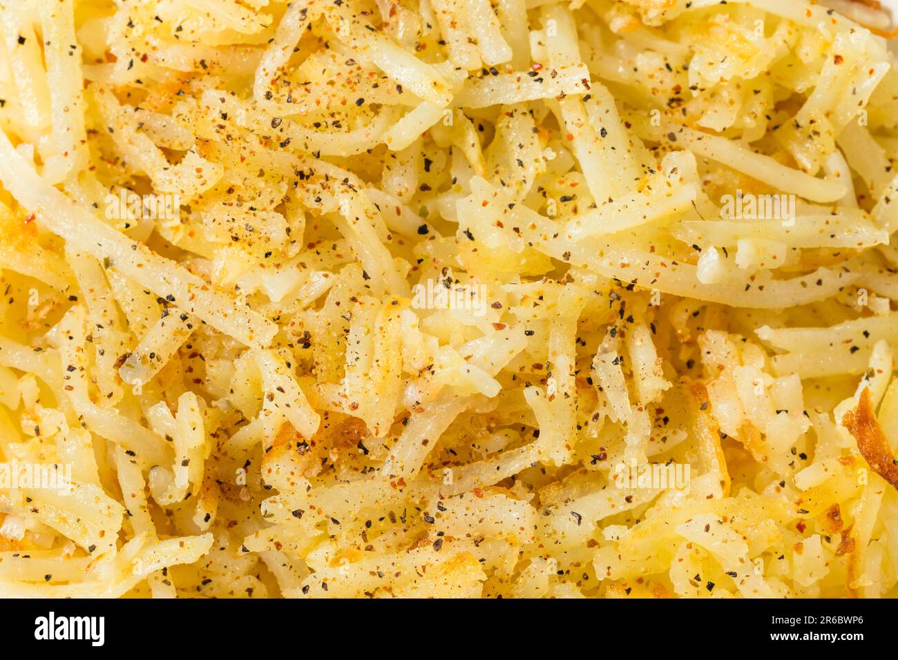 Homemade Breakfast Potato Hash Browns with Salt and Pepper Stock Photo
