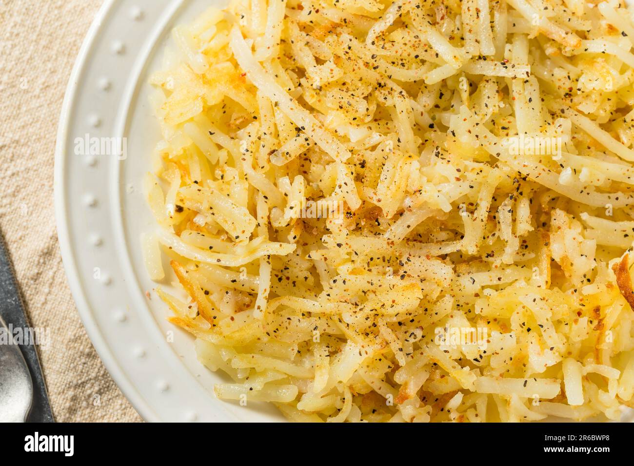 Homemade Breakfast Potato Hash Browns with Salt and Pepper Stock Photo
