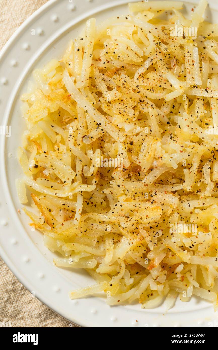 Homemade Breakfast Potato Hash Browns with Salt and Pepper Stock Photo