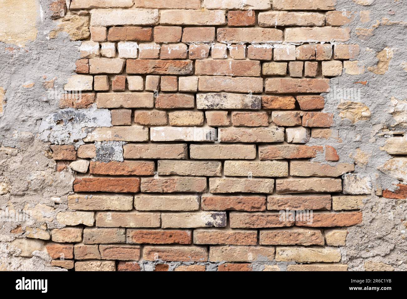 Empty abstract vintage brick wall background framed by cement border Stock Photo