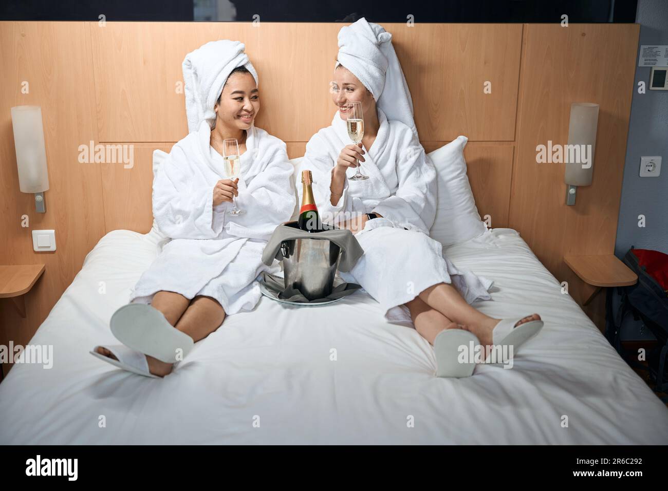 Women with towel on their heads and in white coats Stock Photo Alamy