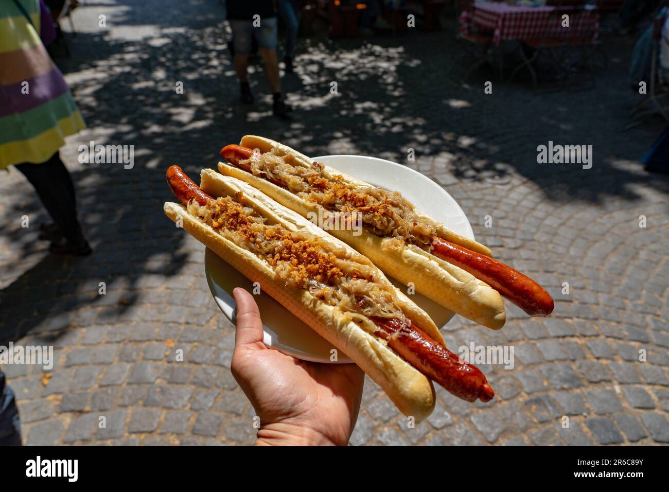 german bavarian hot dog in viktualienmarkt munich with sauerkraut