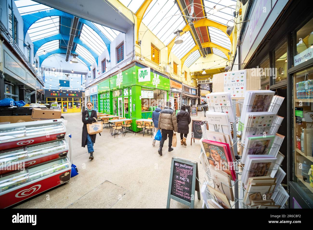 London- March 2023: Brixton Village, part of Brixton Market- an indoor hall of food stalls, bars and shops from multicultural inhabitants Stock Photo