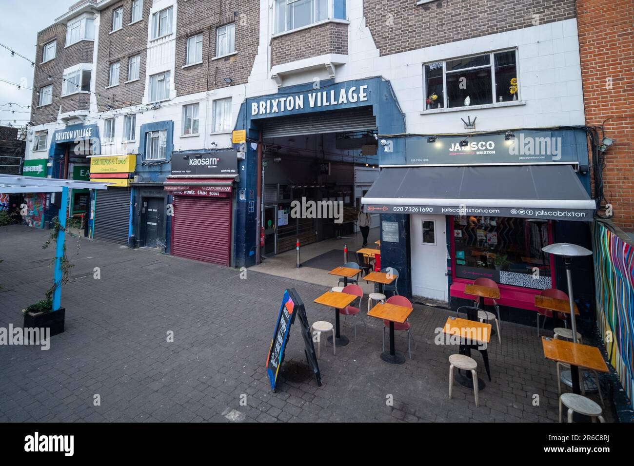 London- March 2023: Brixton Village, part of Brixton Market- an indoor hall of food stalls, bars and shops from multicultural inhabitants Stock Photo