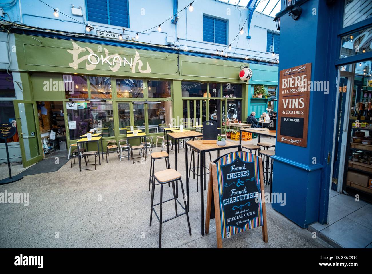 London- March 2023: Brixton Village, part of Brixton Market- an indoor hall of food stalls, bars and shops from multicultural inhabitants Stock Photo