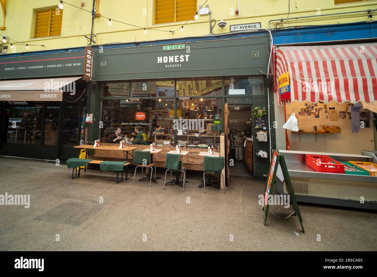 London- March 2023: Brixton Village, part of Brixton Market- an indoor hall of food stalls, bars and shops from multicultural inhabitants Stock Photo