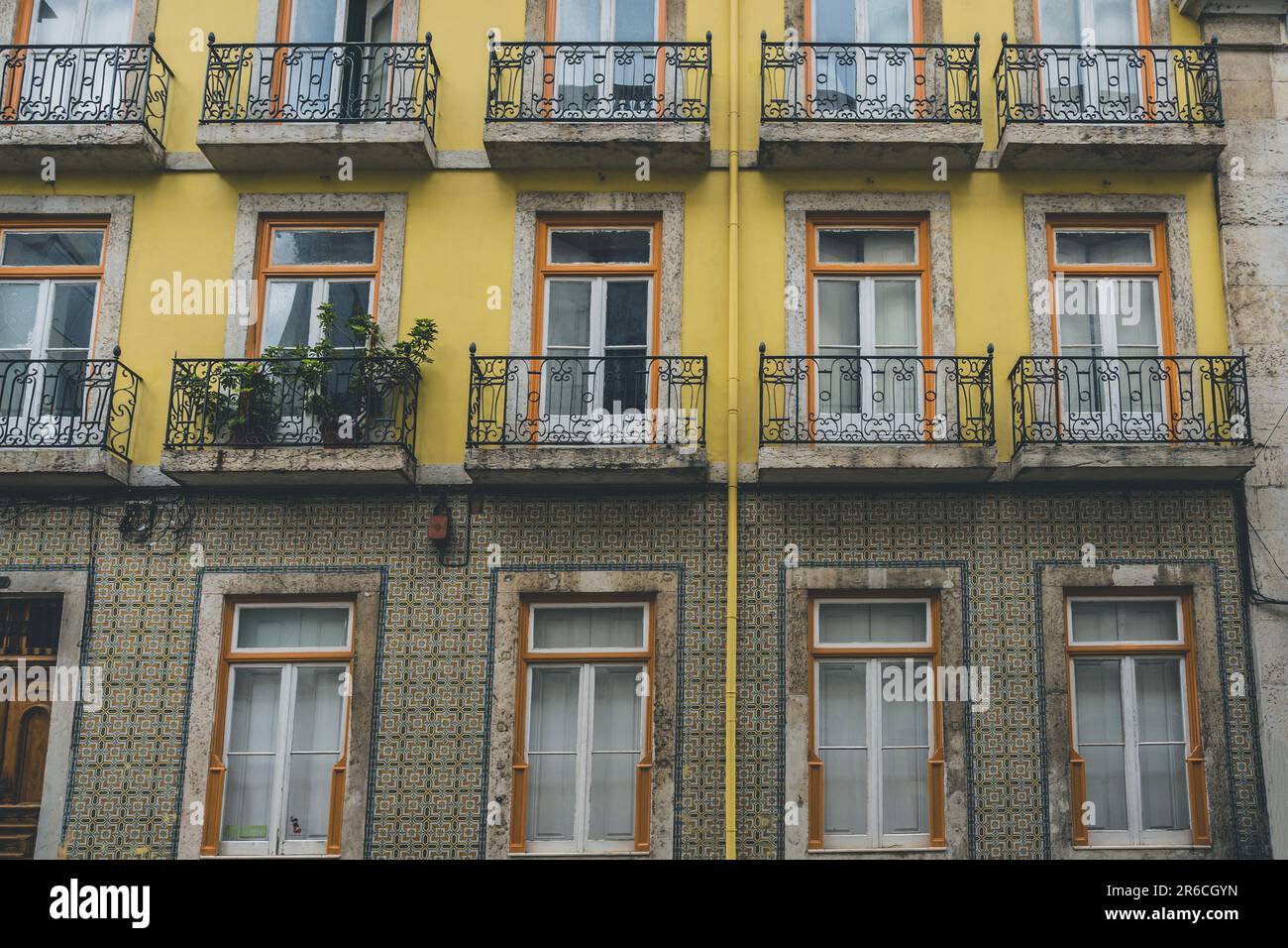 Classic apartment building with balconies and shutters in Lisbon, Portugal Stock Photo